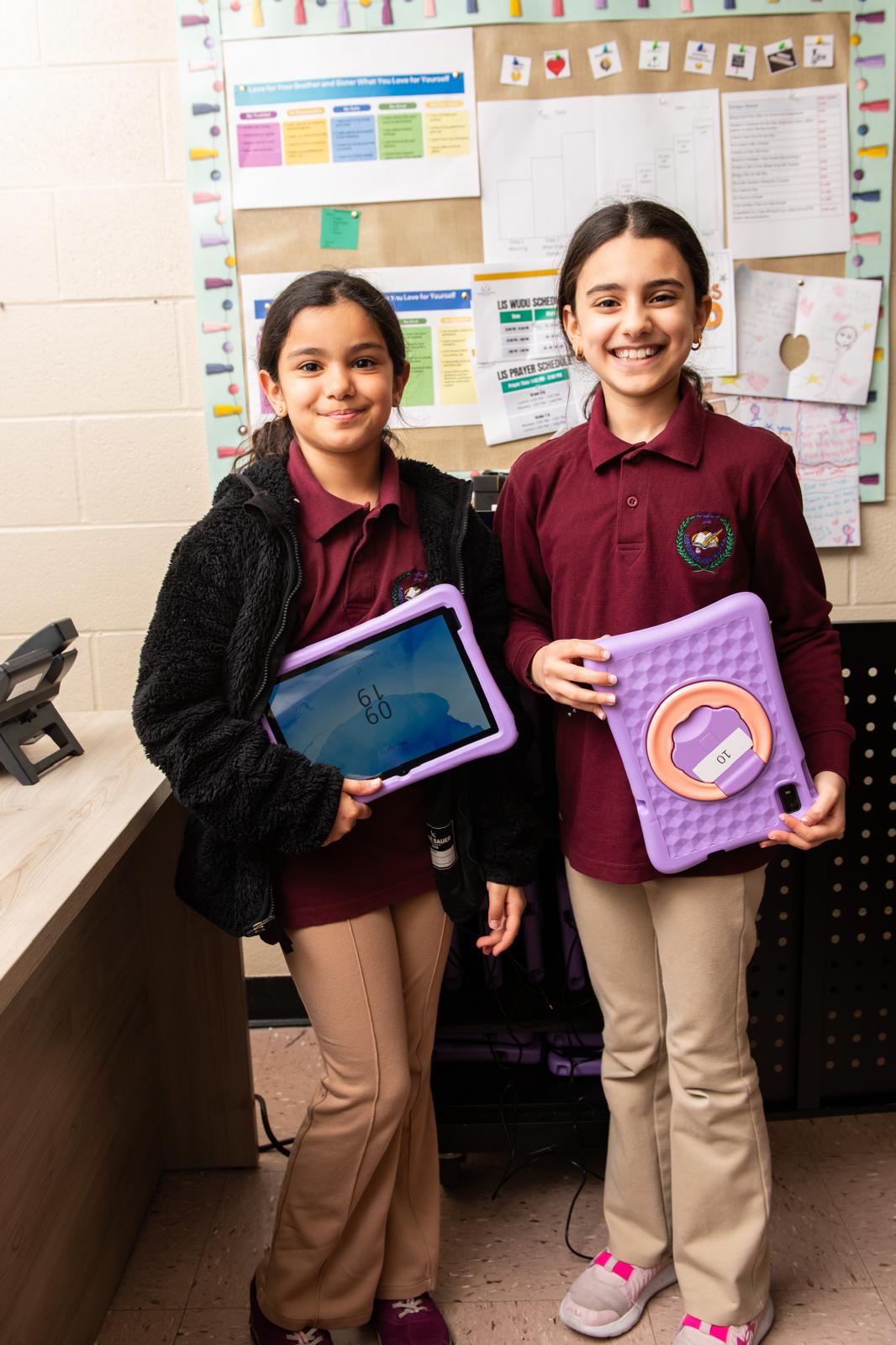 LIS students learning with tablets